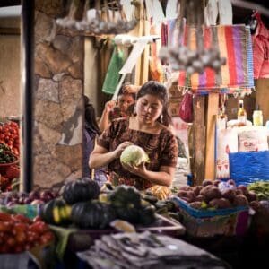 Mayan woman selling fruit at the Chichicastenango market.