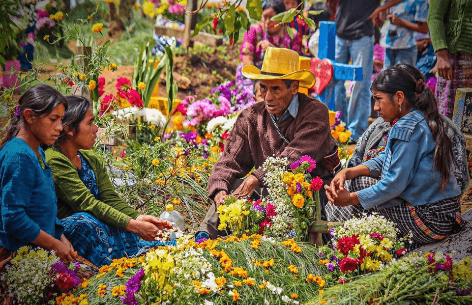 Locals selling flowers at the Solola market