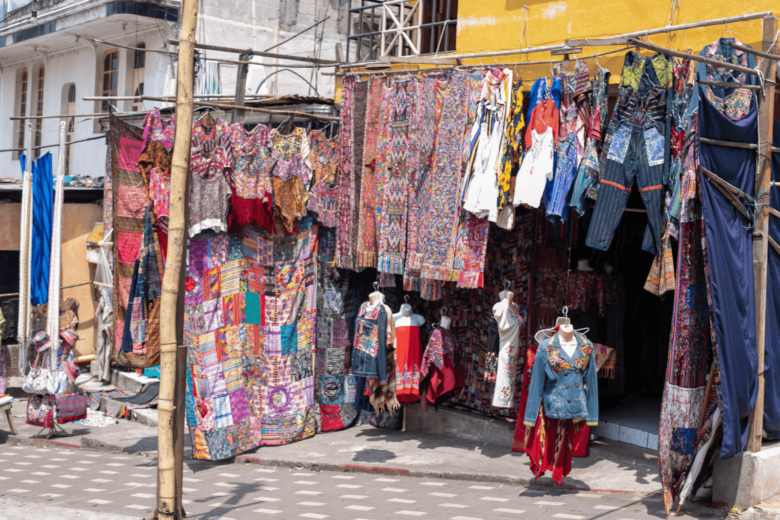 Street vendor selling traditional clothes and weaving.