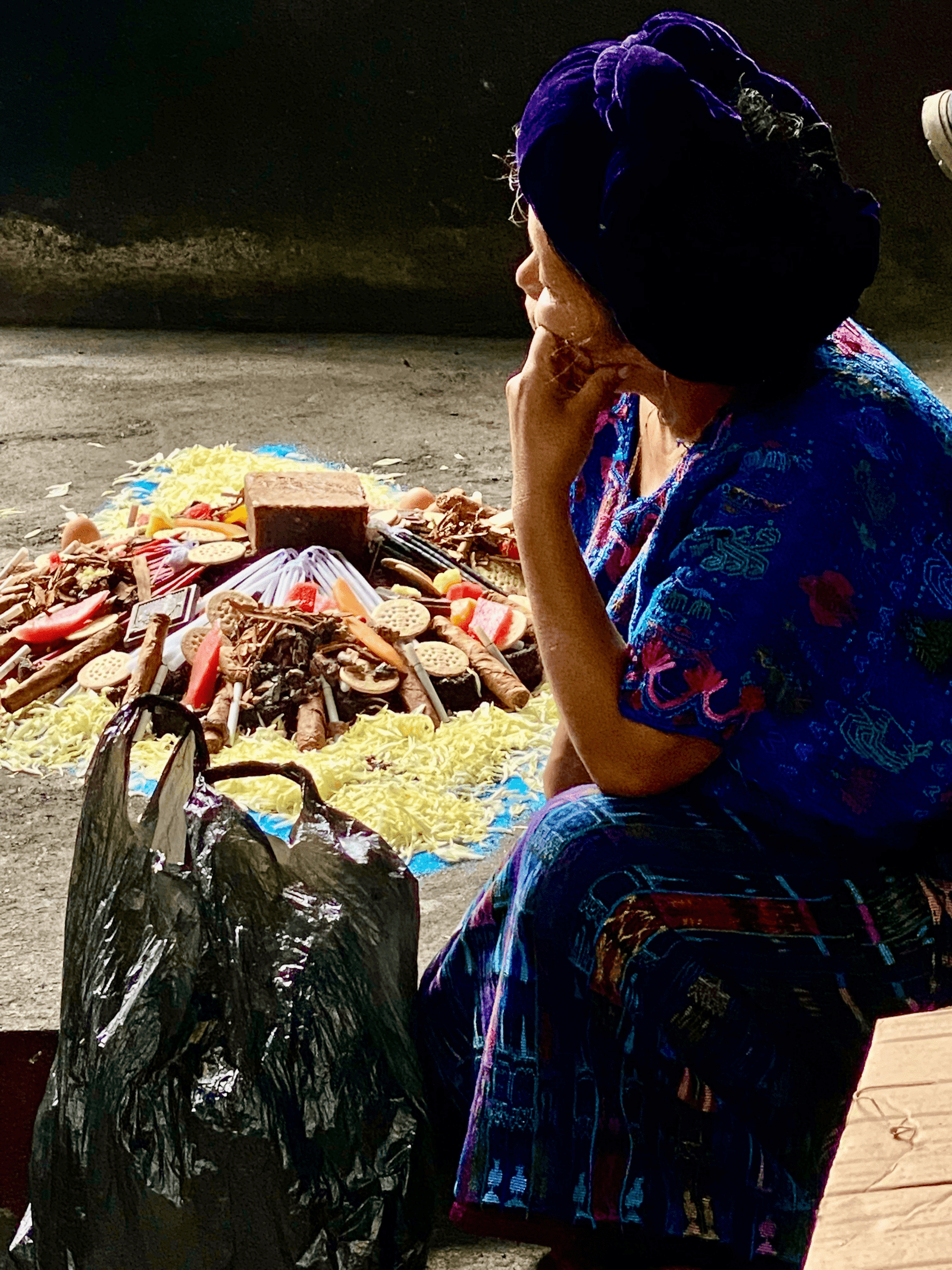 Local mayan woman prepares the offerings for her ceremony. You can share local culture when visiting Lake Atitlan.