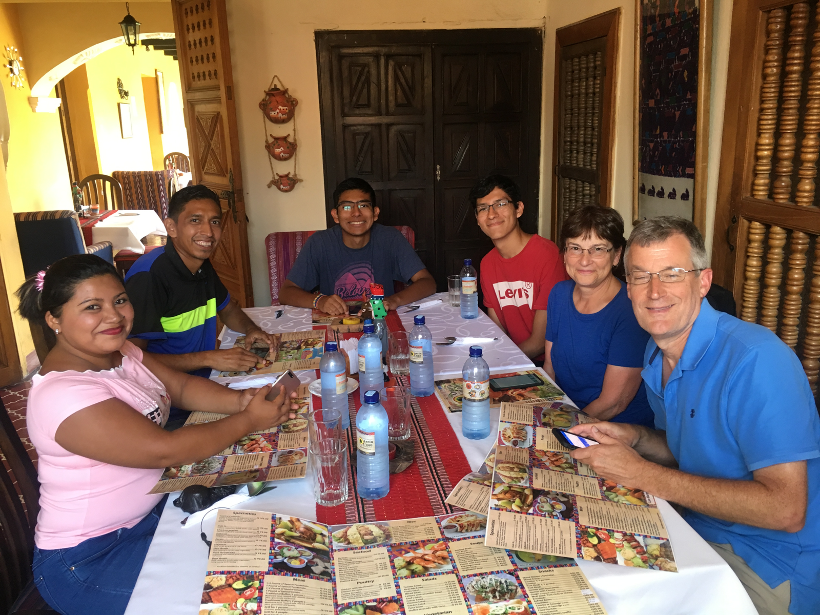 A family enjoying a cooking class. It can be a great activity during rainy season.